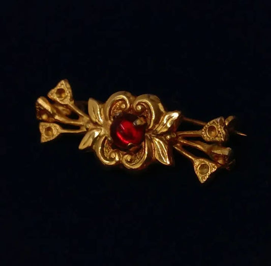 Prendedor de metal dorado